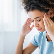 Woman experiencing chronic headaches